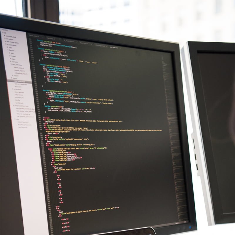 A computer screen showing a code editor with .NET code displayed.