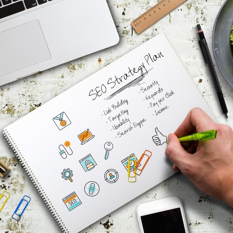 An SEO Expert creating a detailed SEO strategy plan in a paper