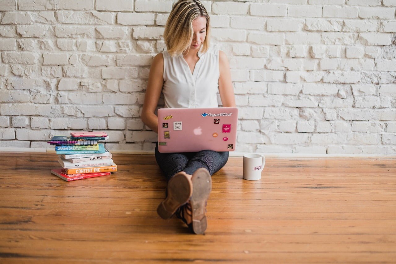 power of long-form content in 2023 -female influencer writing a blog content in the laptop 